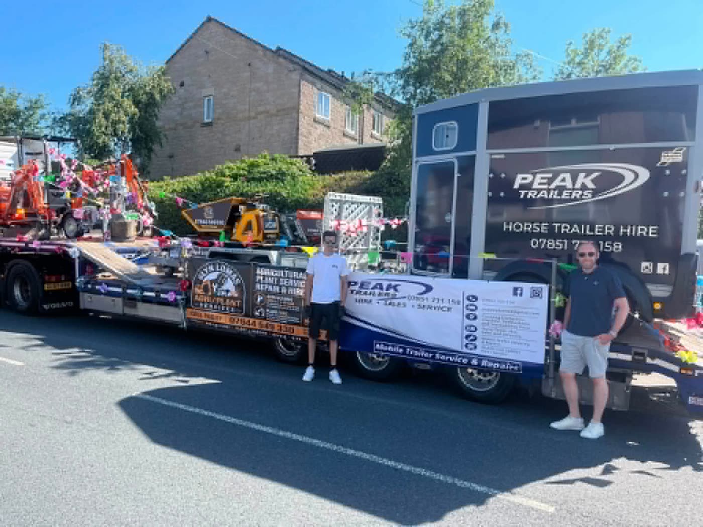 The Glyn Lomas Agri/Plant Services and Peak Trailers float at the local carnival, a decorated mini digger loaded on a low-loader