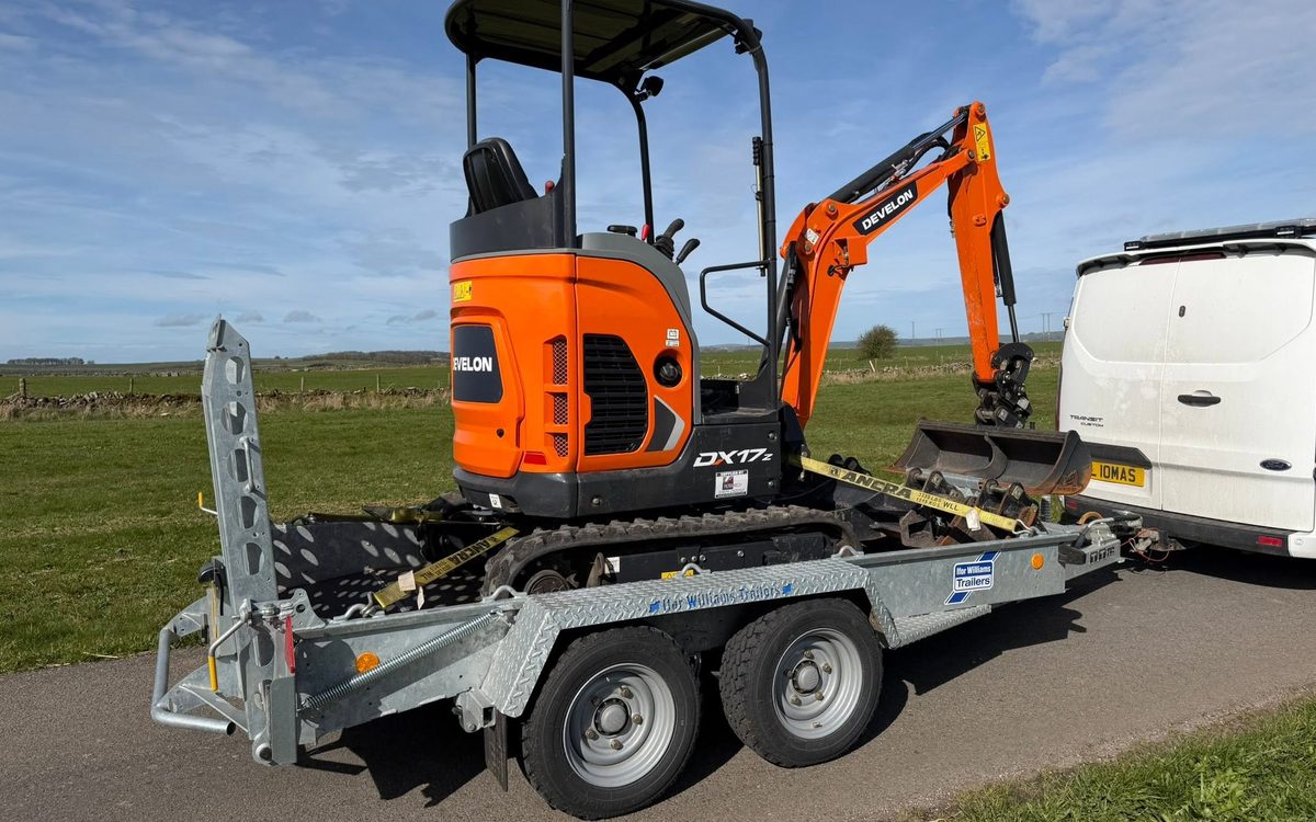 Develon DX17z mini excavator loaded on an Ifor Williams plant trailer ready for delivery